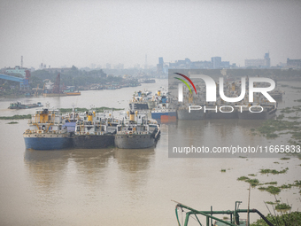 Cargo ships anchor in the Shitalakkhya River in Dhaka, Bangladesh, on October 14, 2024. (