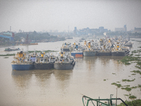 Cargo ships anchor in the Shitalakkhya River in Dhaka, Bangladesh, on October 14, 2024. (