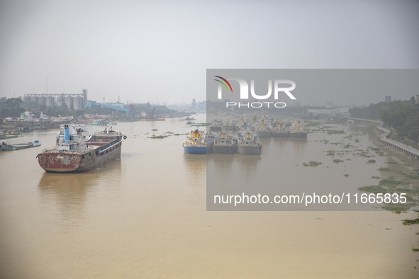 Cargo ships anchor in the Shitalakkhya River in Dhaka, Bangladesh, on October 14, 2024. 