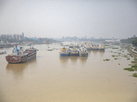 Cargo ships anchor in the Shitalakkhya River in Dhaka, Bangladesh, on October 14, 2024. (