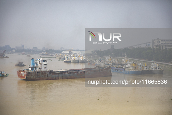 Cargo ships anchor in the Shitalakkhya River in Dhaka, Bangladesh, on October 14, 2024. 