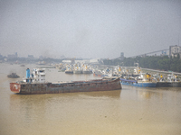 Cargo ships anchor in the Shitalakkhya River in Dhaka, Bangladesh, on October 14, 2024. (