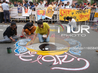 Doctors paint on the street at the protest site. Junior doctors continue their indefinite hunger strike for 211 hours, demanding justice for...