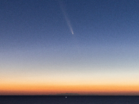 The comet Tsuchinshan-ATLAS (C/2023 A3) is seen over the mountains of the Calabria region from the viewpoint of Torre Uluzzo, near Lecce, It...