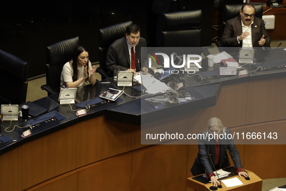 The President of the Senate of Mexico, Gerardo Fernandez Norona, and Jasmine Bugarin, Secretary of the Senate, participate in the drawing of...