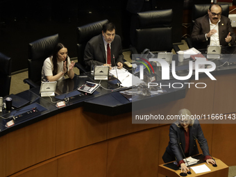 The President of the Senate of Mexico, Gerardo Fernandez Norona, and Jasmine Bugarin, Secretary of the Senate, participate in the drawing of...