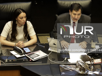 The President of the Senate of Mexico, Gerardo Fernandez Norona, and Jasmine Bugarin, Secretary of the Senate, participate in the drawing of...