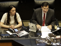 The President of the Senate of Mexico, Gerardo Fernandez Norona, and Jasmine Bugarin, Secretary of the Senate, participate in the drawing of...