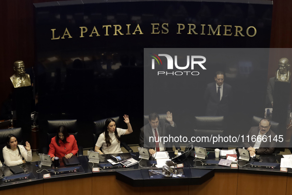 The President of the Senate of Mexico, Gerardo Fernandez Norona, and Jasmine Bugarin, Secretary of the Senate, participate in the drawing of...