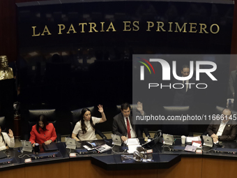 The President of the Senate of Mexico, Gerardo Fernandez Norona, and Jasmine Bugarin, Secretary of the Senate, participate in the drawing of...