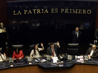 The President of the Senate of Mexico, Gerardo Fernandez Norona, and Jasmine Bugarin, Secretary of the Senate, participate in the drawing of...