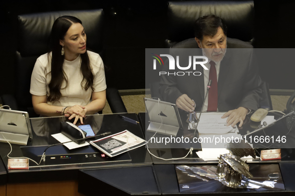 The President of the Senate of Mexico, Gerardo Fernandez Norona, and Jasmine Bugarin, Secretary of the Senate, participate in the drawing of...