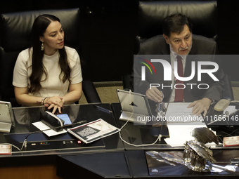 The President of the Senate of Mexico, Gerardo Fernandez Norona, and Jasmine Bugarin, Secretary of the Senate, participate in the drawing of...