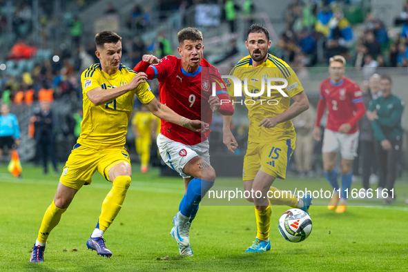 Dmytro Kryskiv, Adam Hlozek, Oleksandr Svatok are playing during the  UEFA Nations League 2024 League B Group B1 match between Ukraine and C...