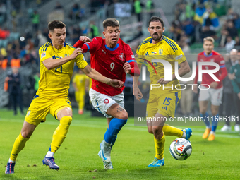 Dmytro Kryskiv, Adam Hlozek, Oleksandr Svatok are playing during the  UEFA Nations League 2024 League B Group B1 match between Ukraine and C...