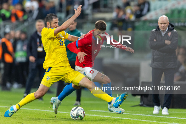 Oleksandr Svatok, Adam Hlozek are playing during the  UEFA Nations League 2024 League B Group B1 match between Ukraine and Czechia , at the...