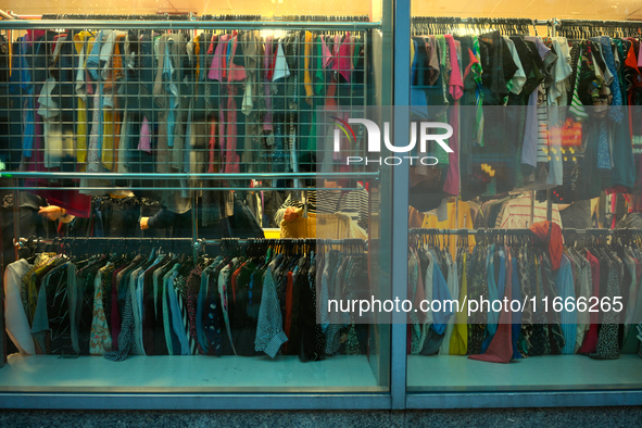 A shopper is seen in a second hand clothing shop in Warsaw, Poland on 14 October, 2024. 