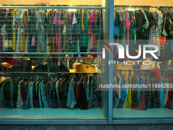 A shopper is seen in a second hand clothing shop in Warsaw, Poland on 14 October, 2024. (