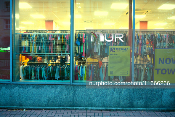 A shopper is seen in a second hand clothing shop in Warsaw, Poland on 14 October, 2024. 