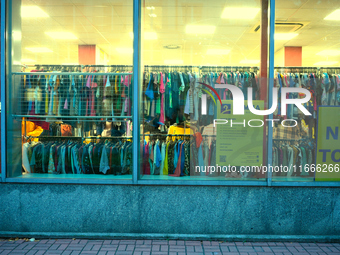 A shopper is seen in a second hand clothing shop in Warsaw, Poland on 14 October, 2024. (