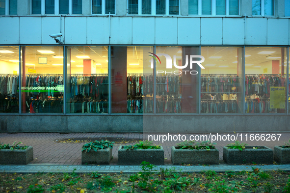 A shopper is seen in a second hand clothing shop in Warsaw, Poland on 14 October, 2024. 