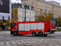 A truck belonging to the special chemical and ecological rescue group is seen speeding through the city center in Warsaw, Poland on 14 Octob...