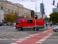 A truck belonging to the special chemical and ecological rescue group is seen speeding through the city center in Warsaw, Poland on 14 Octob...