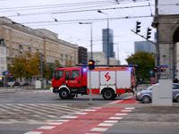 A truck belonging to the special chemical and ecological rescue group is seen speeding through the city center in Warsaw, Poland on 14 Octob...