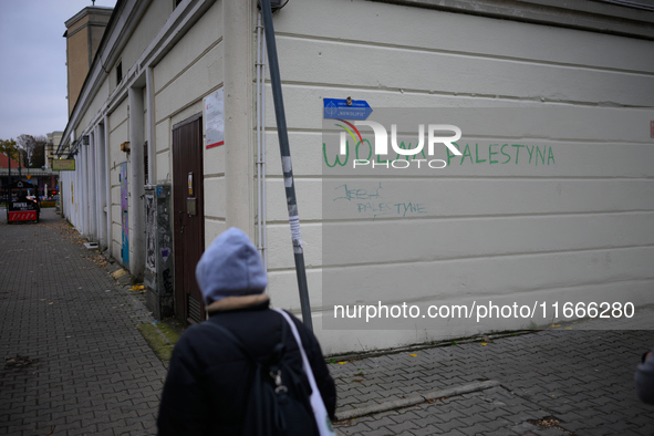 ''Free Palestine'' is seen written on a wall in Warsaw, Poland on 14 October, 2024. 