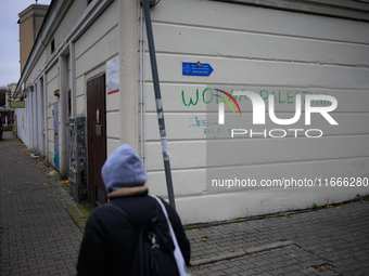 ''Free Palestine'' is seen written on a wall in Warsaw, Poland on 14 October, 2024. (