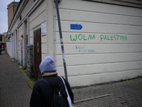 ''Free Palestine'' is seen written on a wall in Warsaw, Poland on 14 October, 2024. (