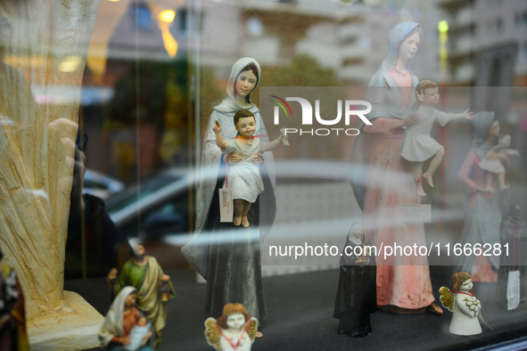 Religious sculptures are seen on display in a window display in Warsaw, Poland on 14 October, 2024. 