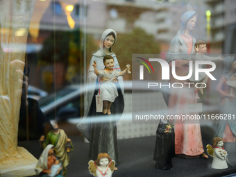 Religious sculptures are seen on display in a window display in Warsaw, Poland on 14 October, 2024. (