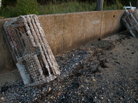 Barnacle-covered and decaying lobster traps, locally known as lobster pots. (