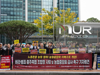 Members of the National Financial and Service Labor Union gather outside the main office of the National Agricultural Cooperative Federation...