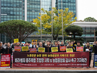 Members of the National Financial and Service Labor Union gather outside the main office of the National Agricultural Cooperative Federation...