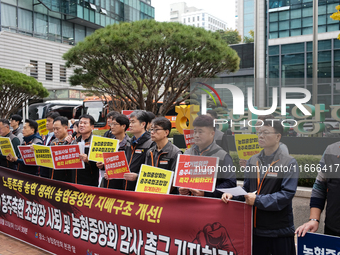 Members of the National Financial and Service Labor Union gather outside the main office of the National Agricultural Cooperative Federation...