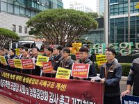 Members of the National Financial and Service Labor Union gather outside the main office of the National Agricultural Cooperative Federation...