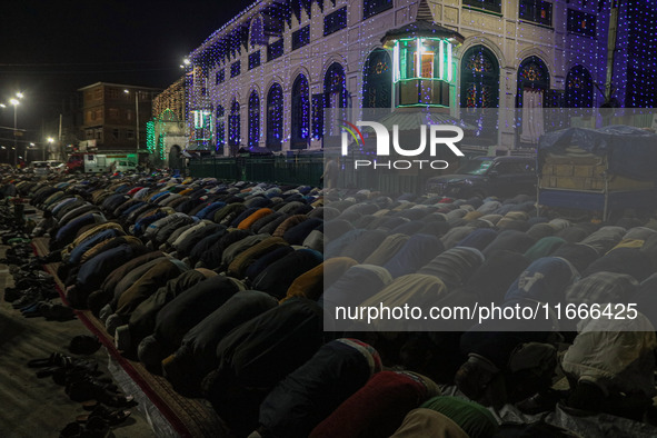 Kashmiri Muslims offer prayers at the shrine of Sheikh Abdul Qadir Jeelani, a Sufi saint, on his death anniversary outside his shrine in Sri...