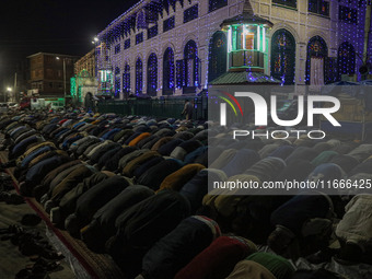 Kashmiri Muslims offer prayers at the shrine of Sheikh Abdul Qadir Jeelani, a Sufi saint, on his death anniversary outside his shrine in Sri...