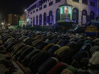 Kashmiri Muslims offer prayers at the shrine of Sheikh Abdul Qadir Jeelani, a Sufi saint, on his death anniversary outside his shrine in Sri...