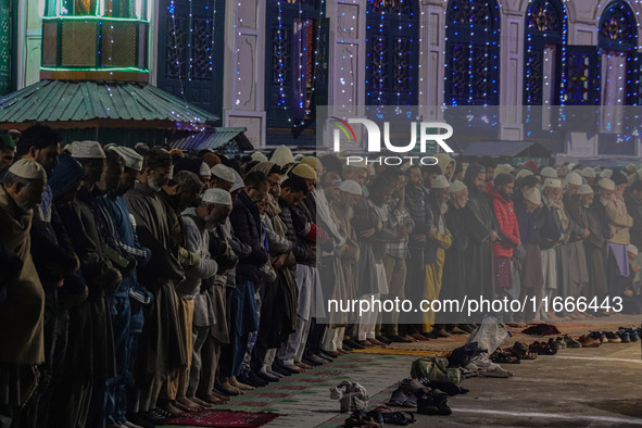 Kashmiri Muslims offer prayers at the shrine of Sheikh Abdul Qadir Jeelani, a Sufi saint, on his death anniversary outside his shrine in Sri...