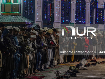 Kashmiri Muslims offer prayers at the shrine of Sheikh Abdul Qadir Jeelani, a Sufi saint, on his death anniversary outside his shrine in Sri...