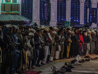 Kashmiri Muslims offer prayers at the shrine of Sheikh Abdul Qadir Jeelani, a Sufi saint, on his death anniversary outside his shrine in Sri...