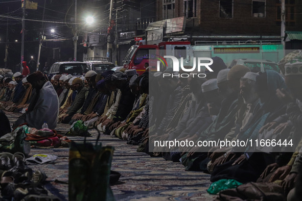 Kashmiri Muslims offer prayers at the shrine of Sheikh Abdul Qadir Jeelani, a Sufi saint, on his death anniversary outside his shrine in Sri...