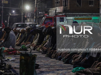 Kashmiri Muslims offer prayers at the shrine of Sheikh Abdul Qadir Jeelani, a Sufi saint, on his death anniversary outside his shrine in Sri...