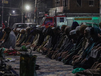 Kashmiri Muslims offer prayers at the shrine of Sheikh Abdul Qadir Jeelani, a Sufi saint, on his death anniversary outside his shrine in Sri...