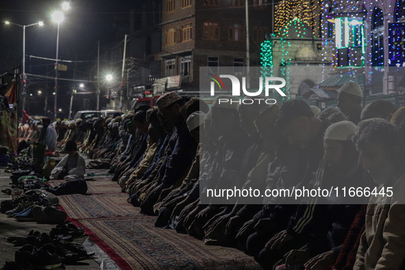 Kashmiri Muslims offer prayers at the shrine of Sheikh Abdul Qadir Jeelani, a Sufi saint, on his death anniversary outside his shrine in Sri...