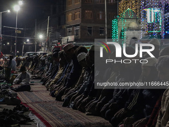 Kashmiri Muslims offer prayers at the shrine of Sheikh Abdul Qadir Jeelani, a Sufi saint, on his death anniversary outside his shrine in Sri...