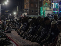 Kashmiri Muslims offer prayers at the shrine of Sheikh Abdul Qadir Jeelani, a Sufi saint, on his death anniversary outside his shrine in Sri...